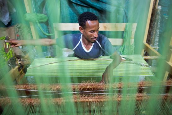 soleRebels' artisan factory workers use traditional methods, spinning cotton with an inzert spindle and weaving with traditional wooden loom