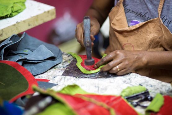 Artisans hammer out shoe fabric by hand