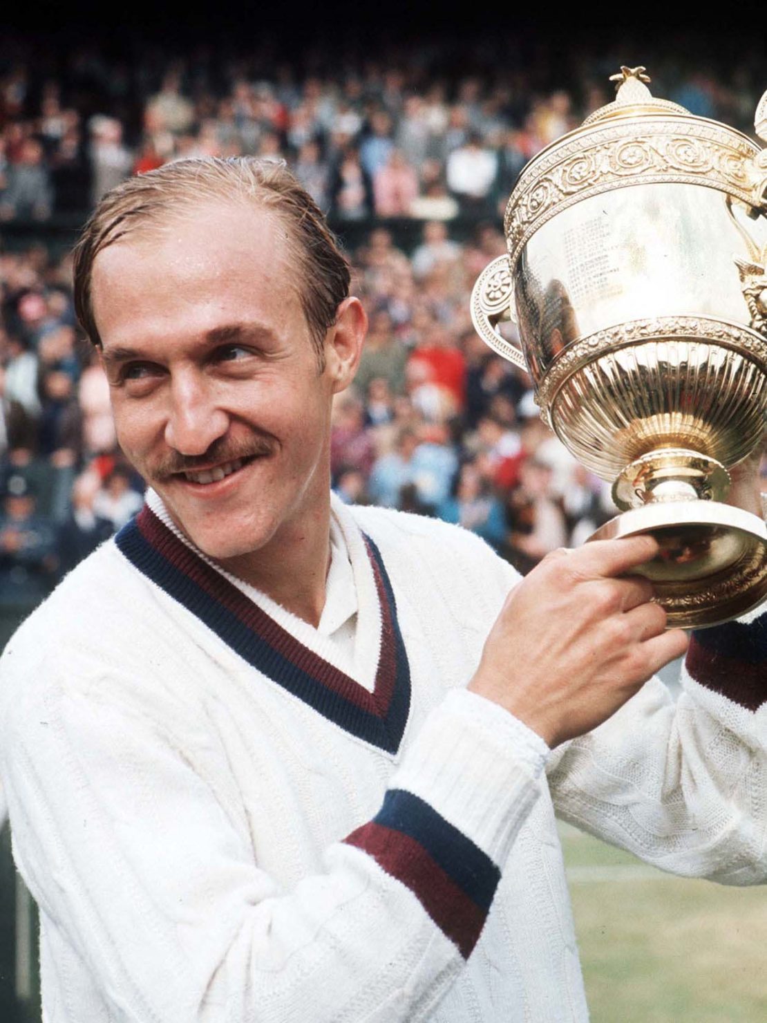 Stan Smith holds up the Wimbledon trophy in 1972