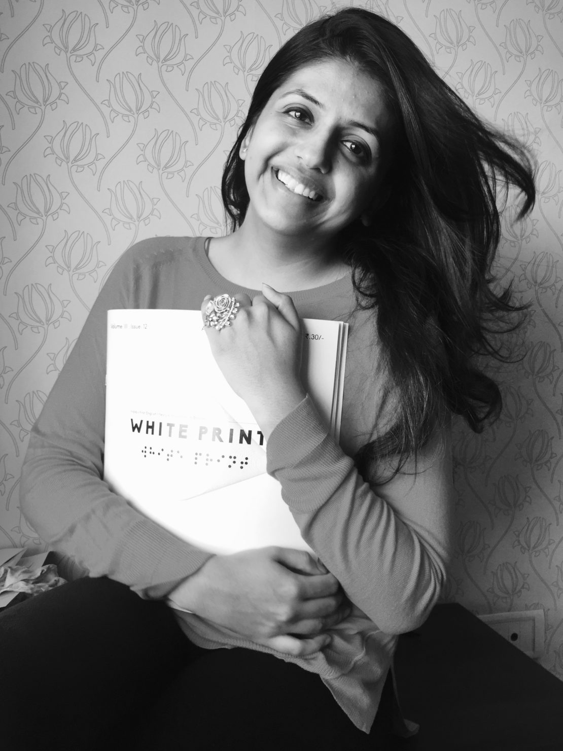 Upasana Makati with a copy of her magazine, White Print